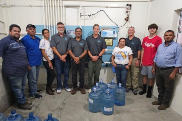 Our Agua Viva Team, Luis, Mauricio, Evelyn, Daryl (US Honduras Coordinator). Rigo (Honduras In-country Coordinator), Jacob (US), Marielena, Jerry (US), Brayden (US) and Pastor Herman. Picture at the Water Room at El Pantano, Honduras during a stewardship visit.