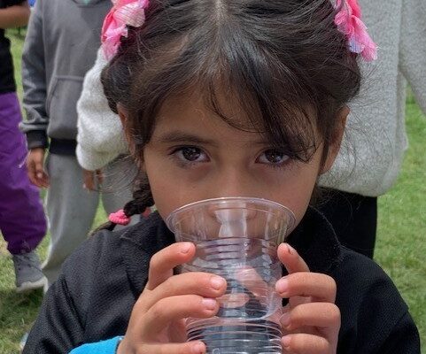 Girl from Balanya drinking purified water