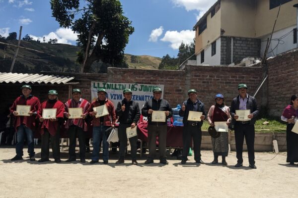 The community educators and operators proudly showing their well-earned certificates