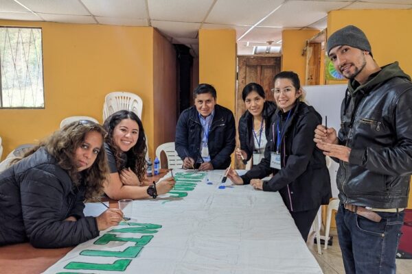 Our education team preparing the banner (l to r, Nube, Keily (US), Rodrigo, Elena, Mayra and Fahres)