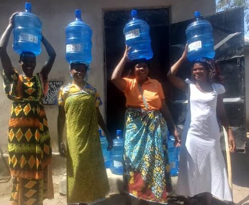 Purified water ready for delivery – so much better than balancing lake water in open buckets!