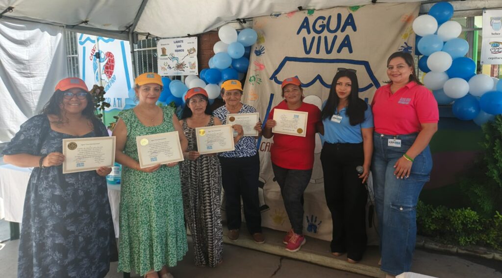 Education team with their diplomas and visors Given by Zenayda in blue and Karissa in Pink. CADEP gave the team a mug as a gift