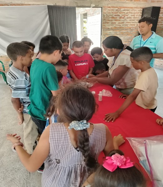 Mayra (Local Educator and the Pastor’s wife) leading an activity to teach how soap separates the bacteria from the water to the kids
